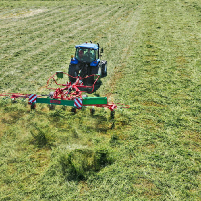 Angled field view of Enorossi VORTEX G6-740 PROFILINE hay tedder in operation