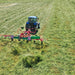 Angled field view of Enorossi VORTEX G6-740 PROFILINE hay tedder in operation