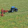 Enorossi VORTEX G6-740 PROFILINE hay tedder operating with tractor on grass field