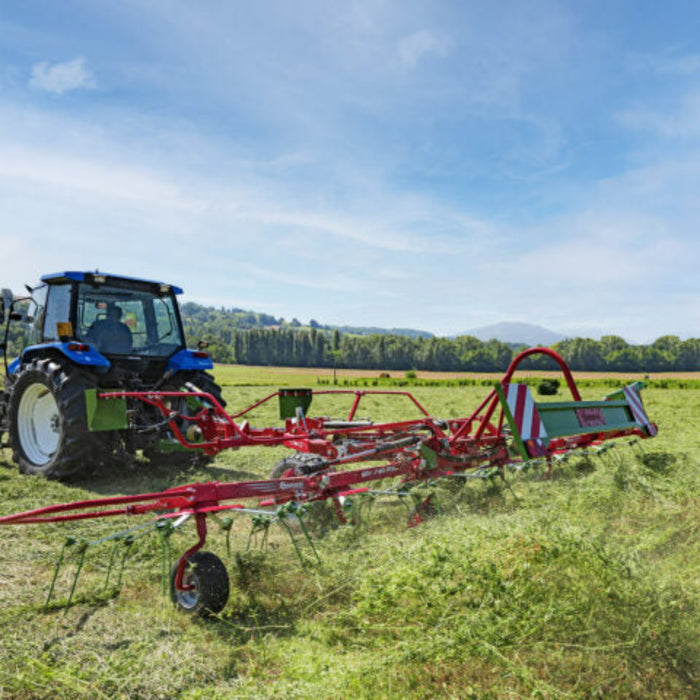 Side view of Enorossi VORTEX G6-740 PROFILINE rotary hay tedder during operation